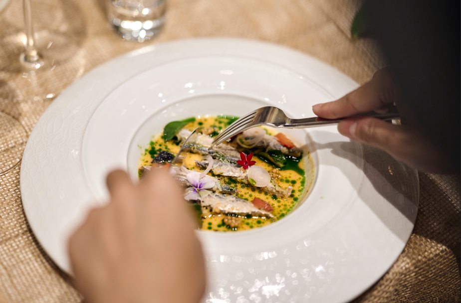 A person eating a soup with a fork

AI-generated content may be incorrect.