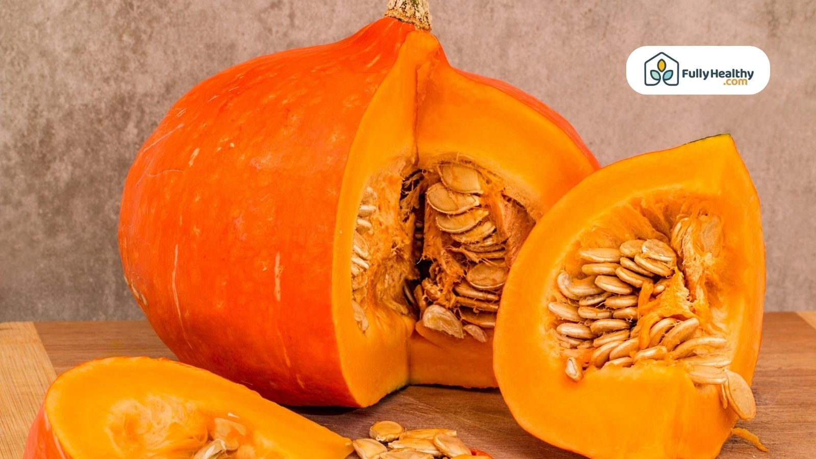 Freshly cut pumpkin showing seeds and vibrant orange flesh.