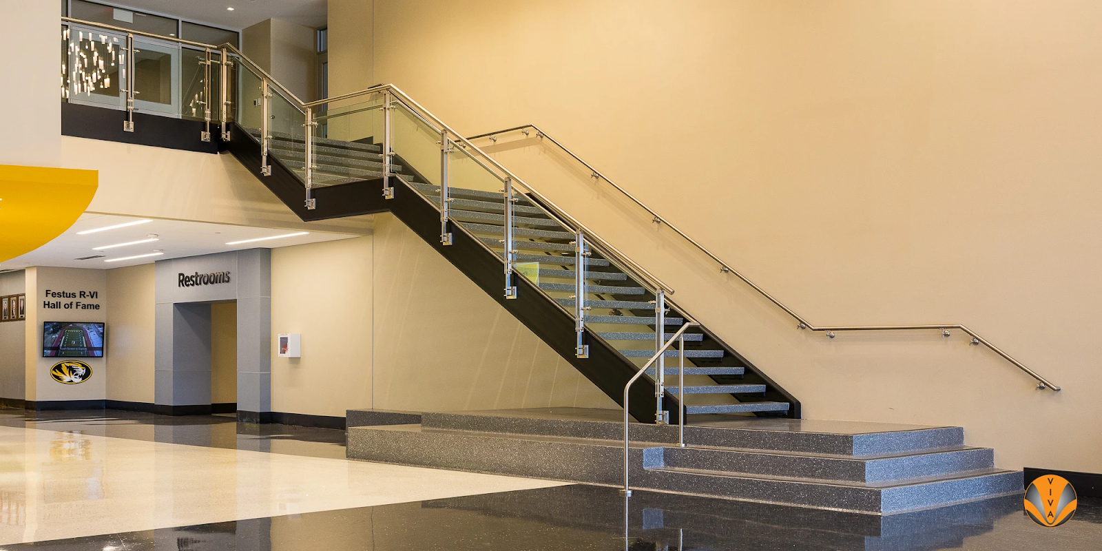 A standard metal railing system inside of a school. 