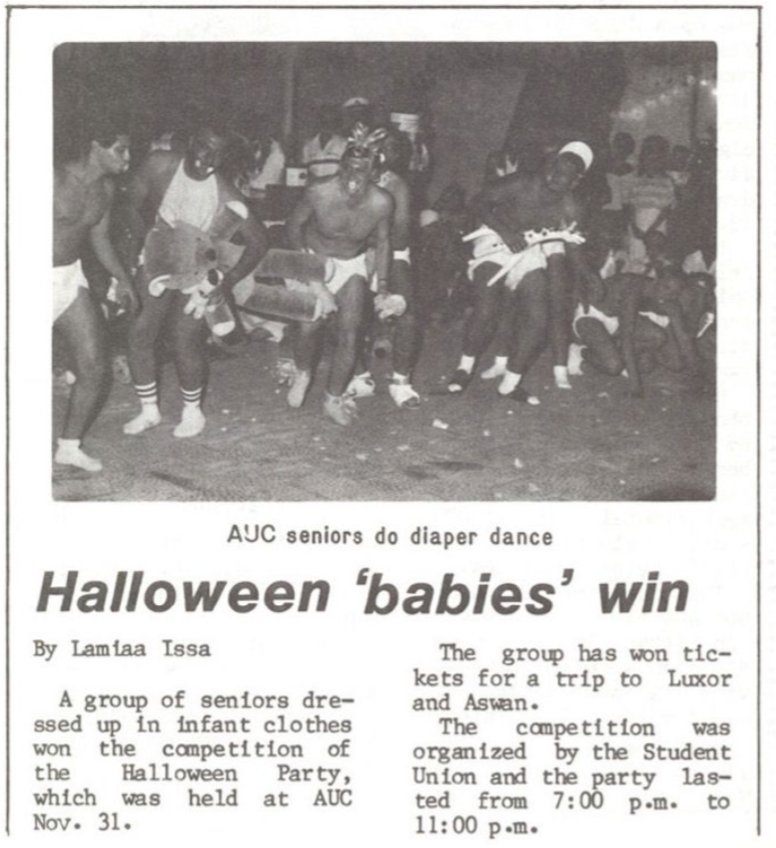 Caravan newspaper clipping showing group of men in diapers, captioned "AUC seniors do diaper dance" and featuring the headline "Halloween 'babies' win" in a reference to the Halloween Party costume competition.