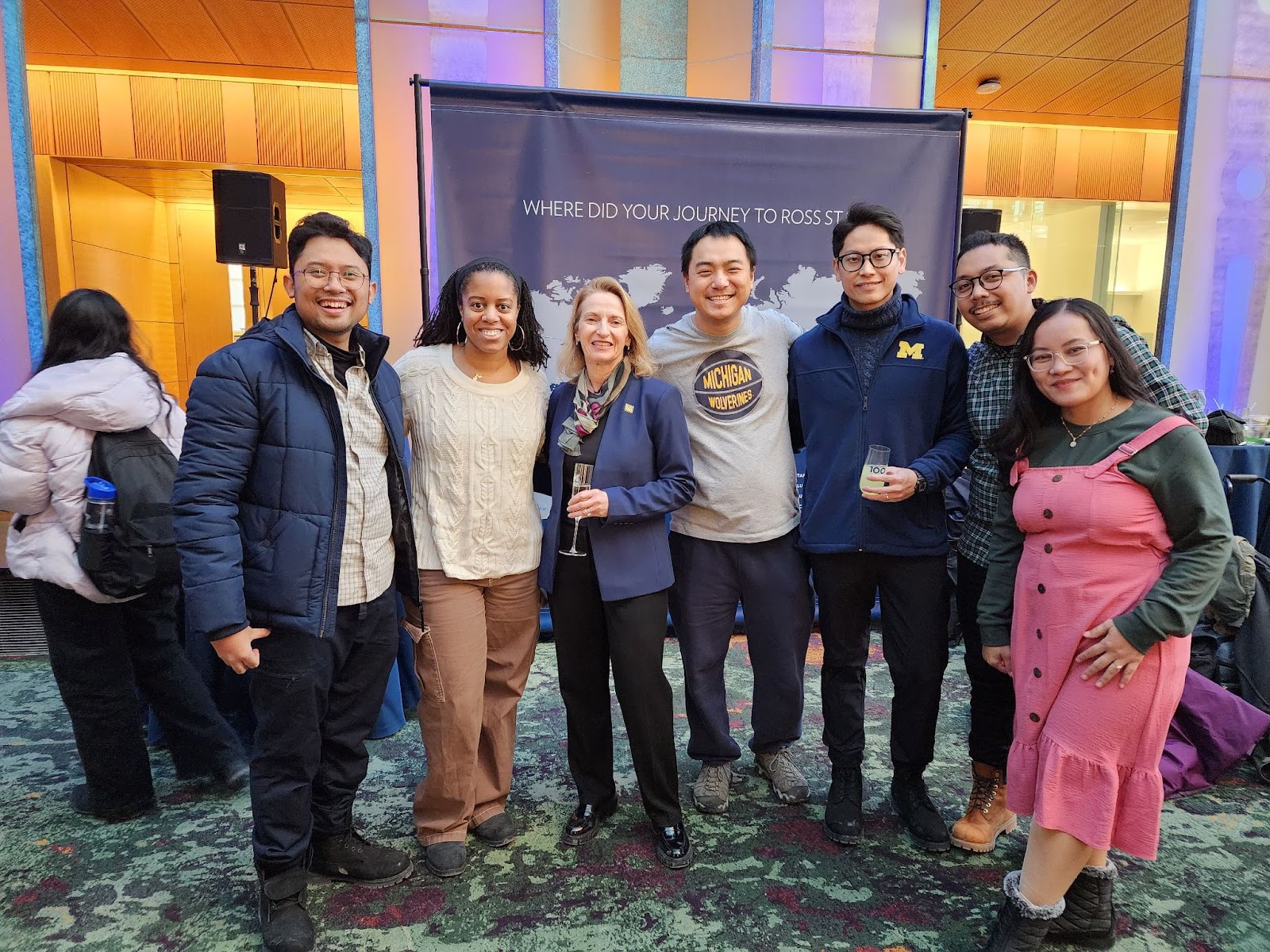 Olivia poses with fellow Wolverines with Dean Thole.