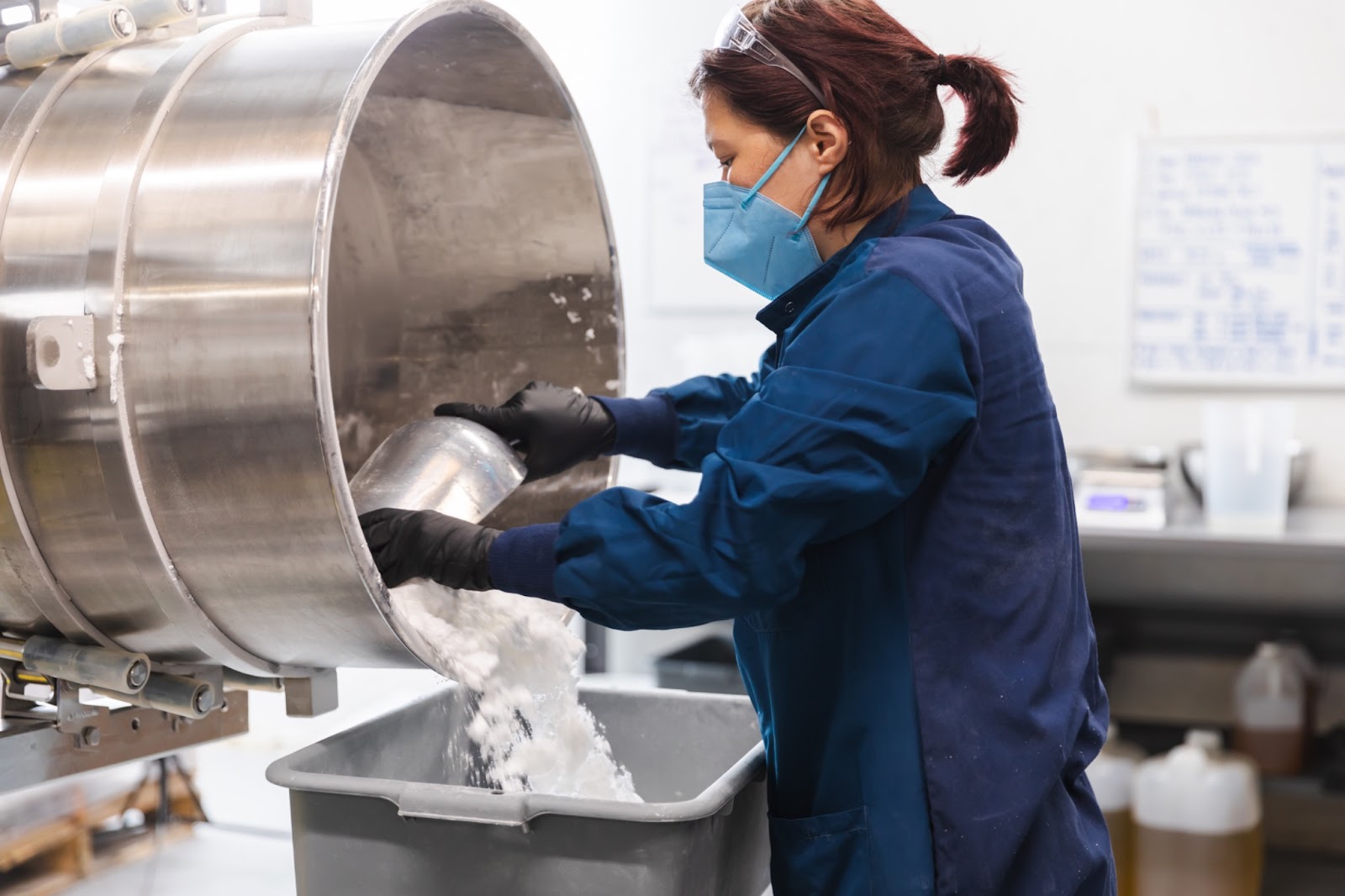 OWC production employee Tori dispersing the mixture to a container