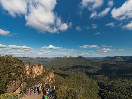 A group of people walking on a path in a valley

AI-generated content may be incorrect.