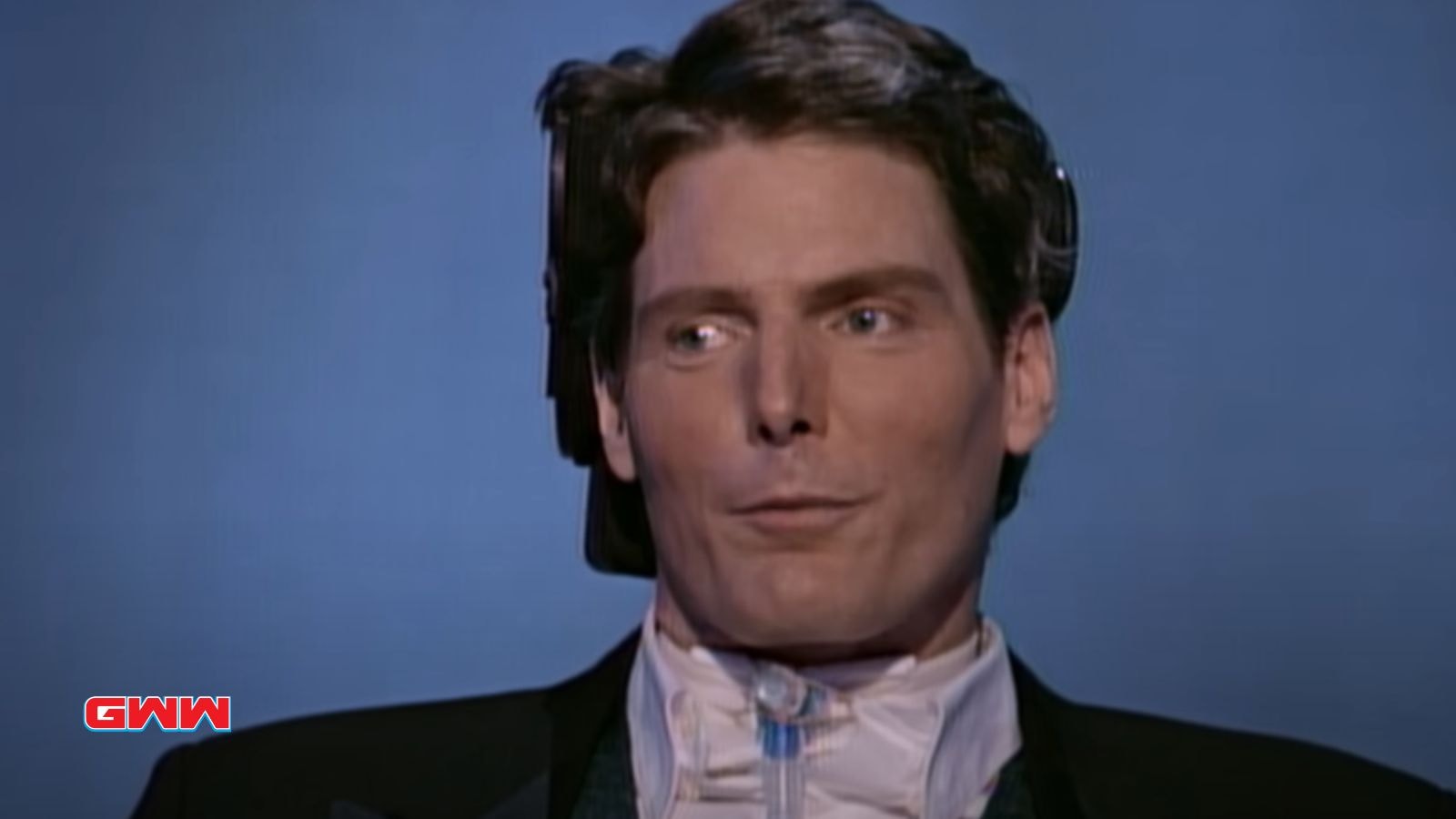 Christopher Reeve in a wheelchair with medical equipment during an interview.