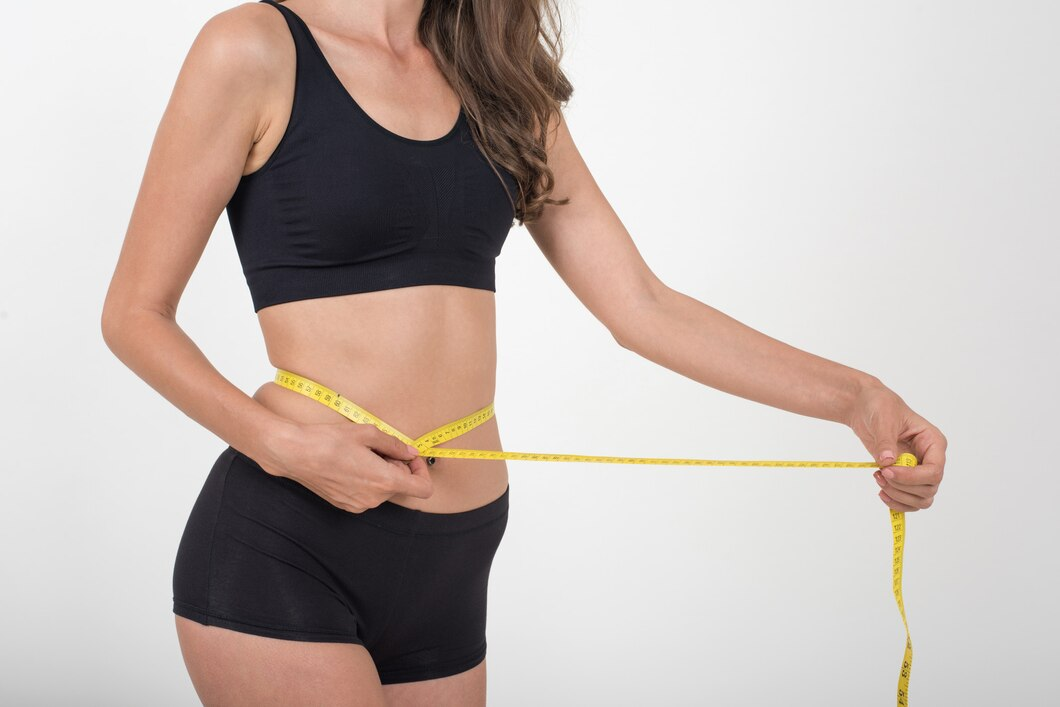 women measuring waist size