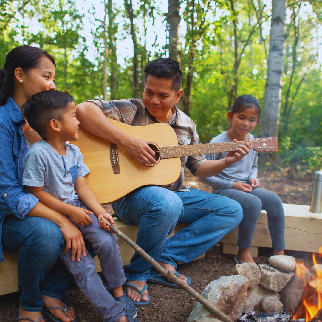 play guitar around a fire