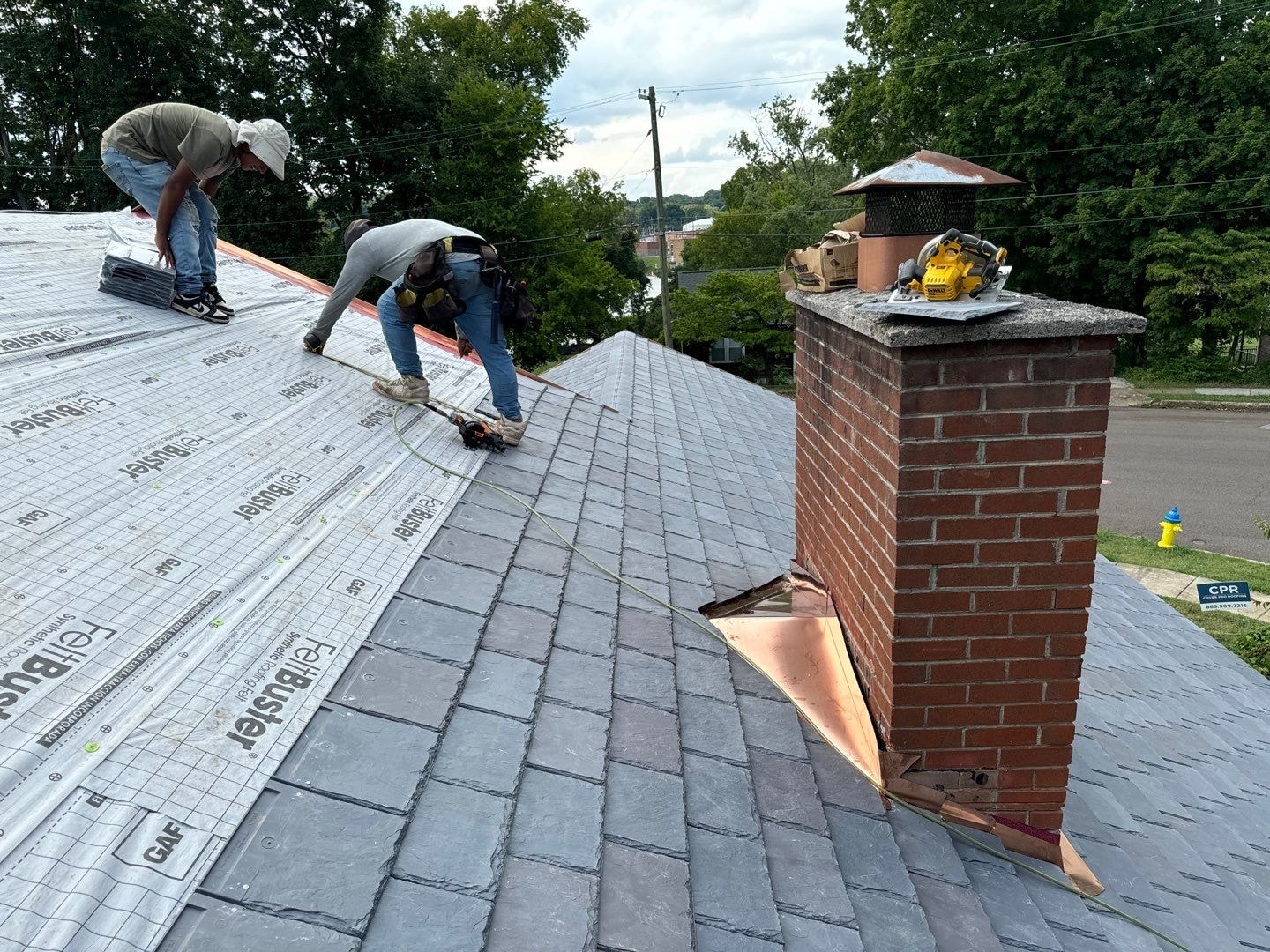 CPR workers working on roof