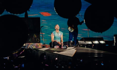 Chris Martin falls through hole in Melbourne stage weeks after Olivia  Rodrigo's mishap | Coldplay | The Guardian