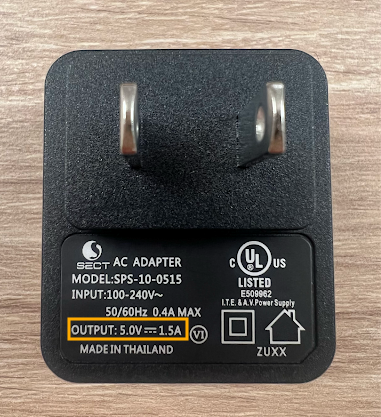 A power adapter with a with a voltage output of 5V, 1.5A.