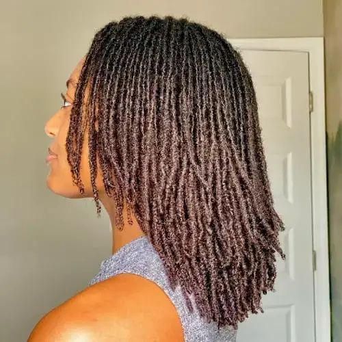 a lady rocking shoulder-length large microlocs