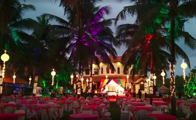 Stunning beach wedding photoshoot at a beautifully decorated venue with trees and lights