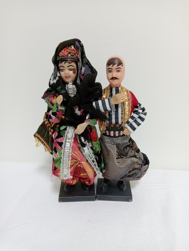 Dolls featuring a Turkish couple in traditional wedding attire