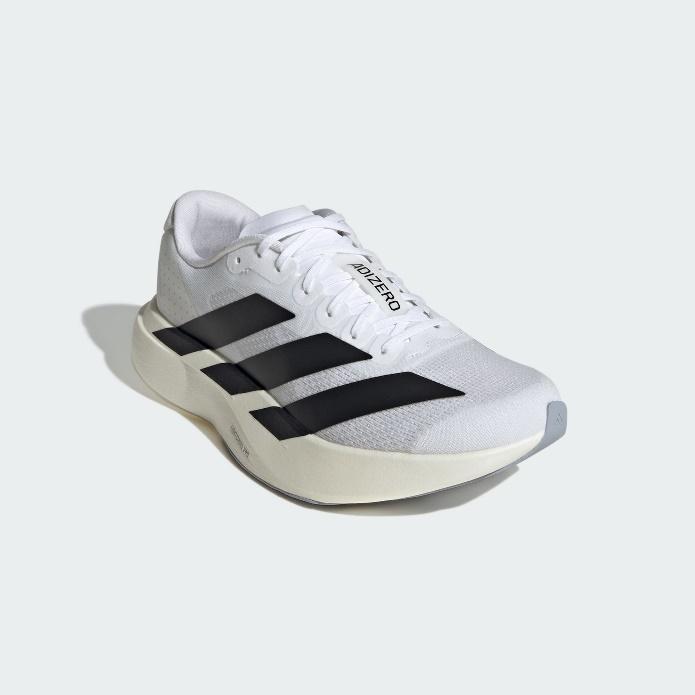 A white and black shoeDescription automatically generated