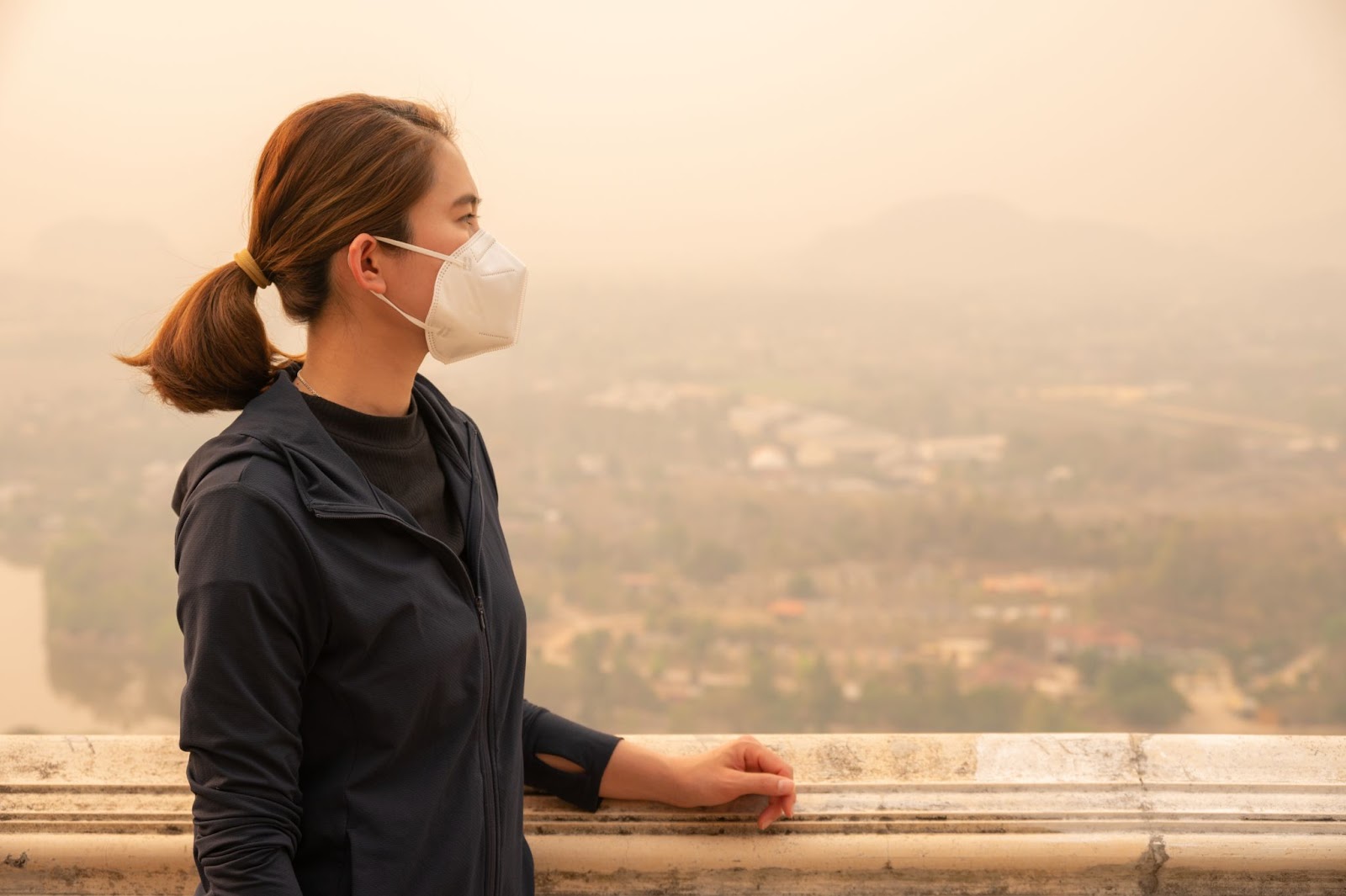 A person wearing a mask outside.