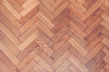 hardwood vs luxury vinyl flooring comparing interior upgrades herringbone pattern floorboards custom built michigan