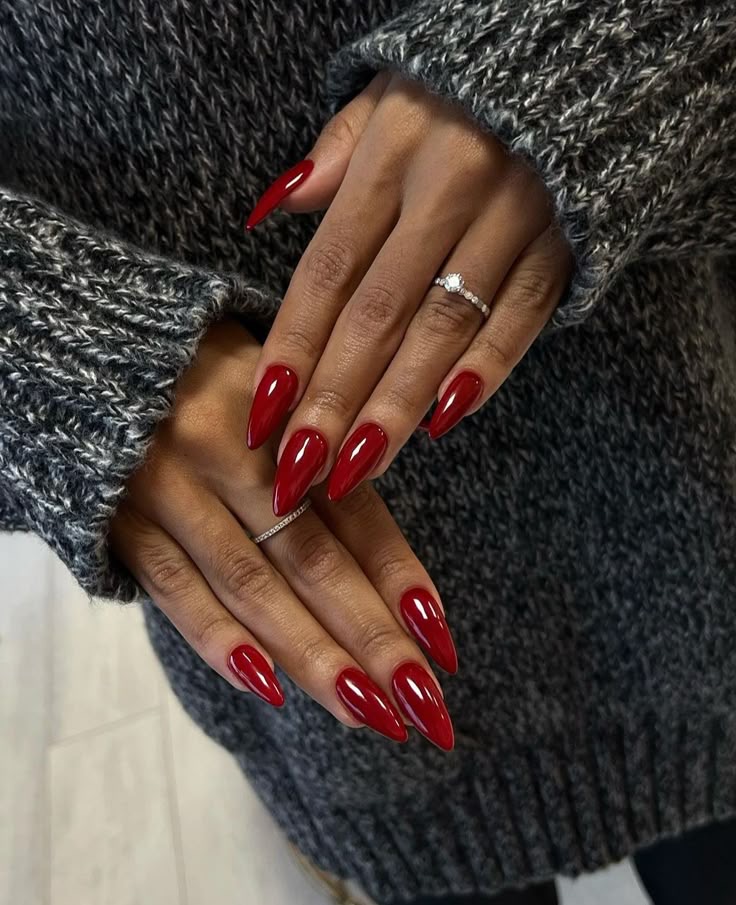 Alt Text: Dark red stiletto nails with a glossy finish, exuding elegance via Pinterest (original creator unknown). If this is your work, please contact us for credit.