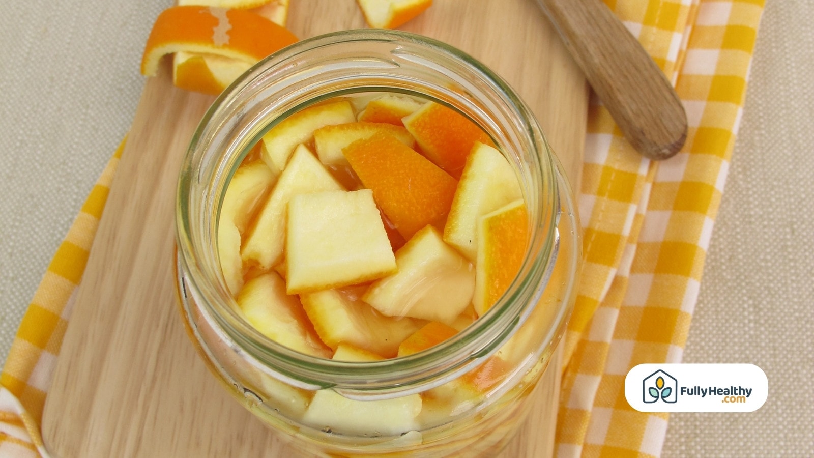 Jar filled with chopped citrus peels and vinegar mixture