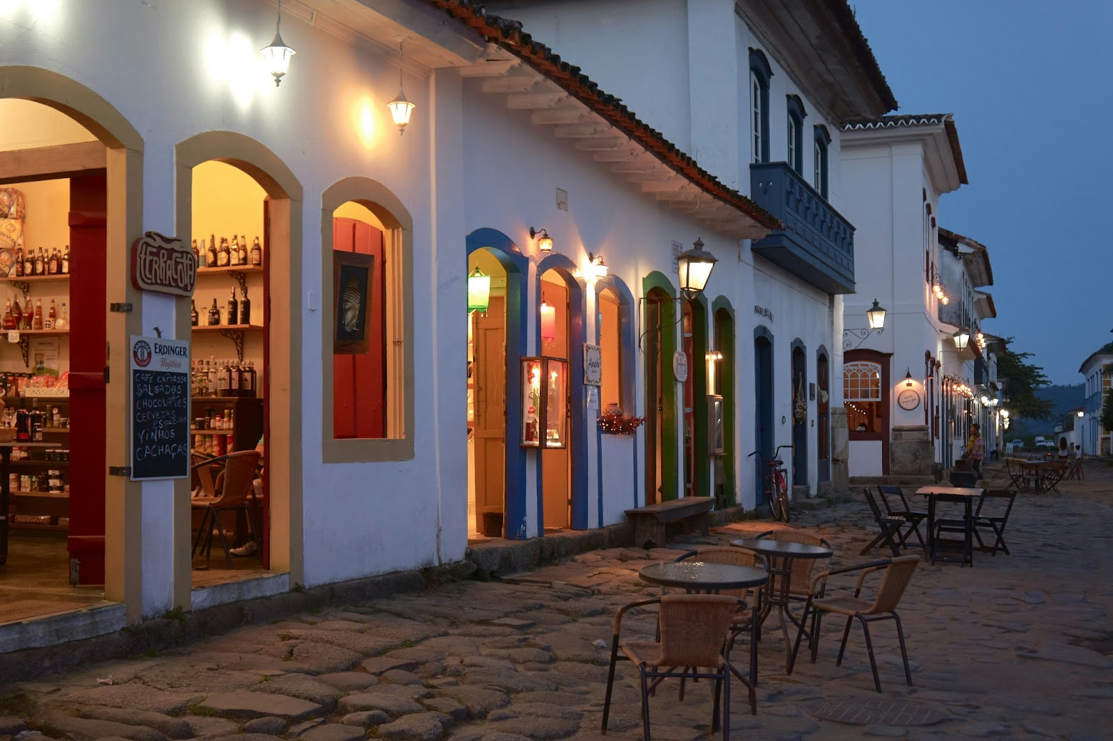 Upscale beachfront restaurants in Cambury Beach, São Paulo, with luxury seating and a sunset view.