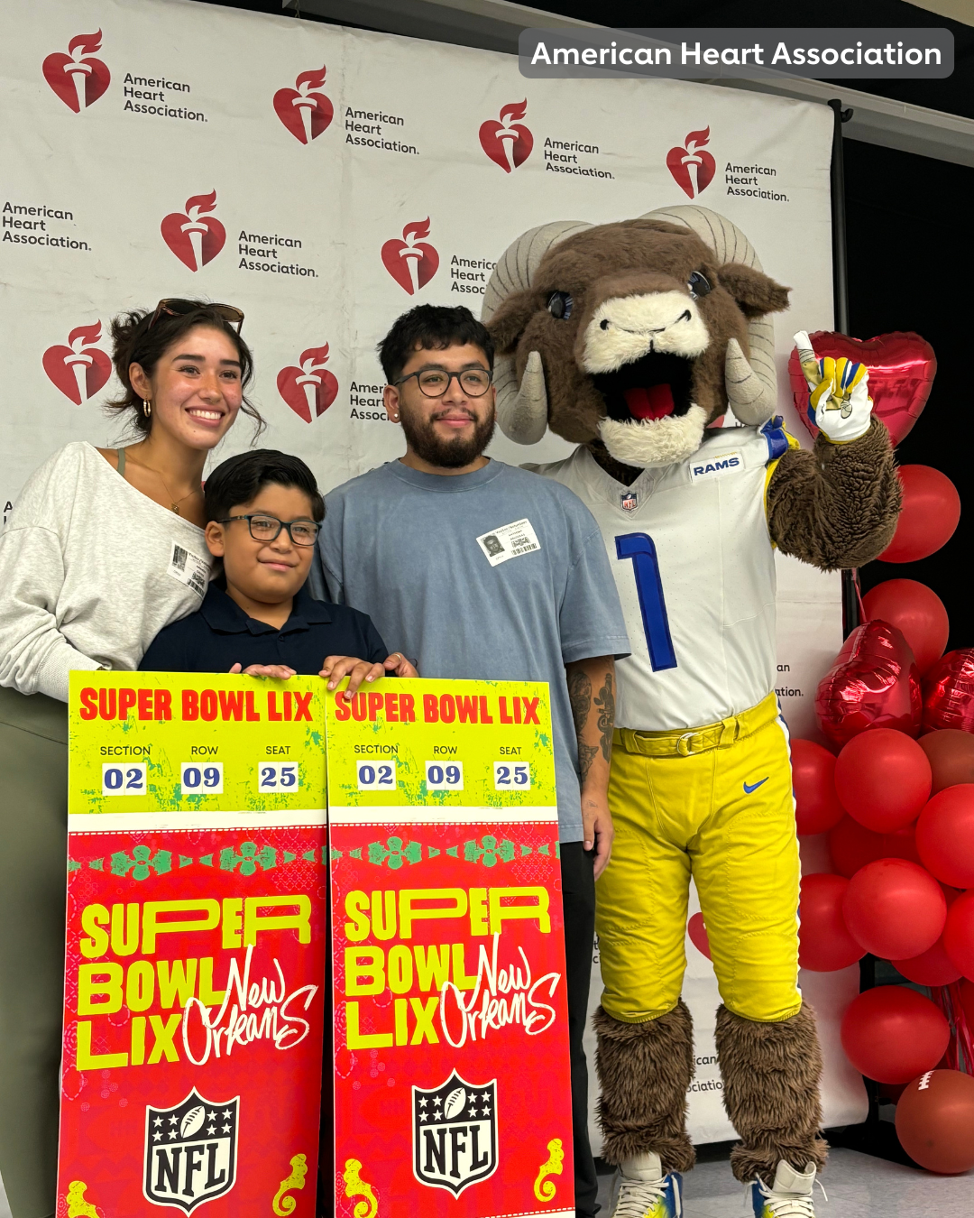 Student with parents on stage with Los Angeles Rams mascot,  Rampage.