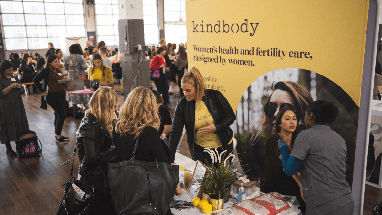 People speaking at a sponsored table