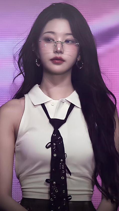 IVE Jang Wonyoung putting on off white top and glasses