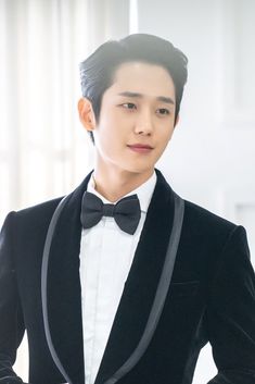 This contains an image of Jae Hae-In on a black suit looking handsome