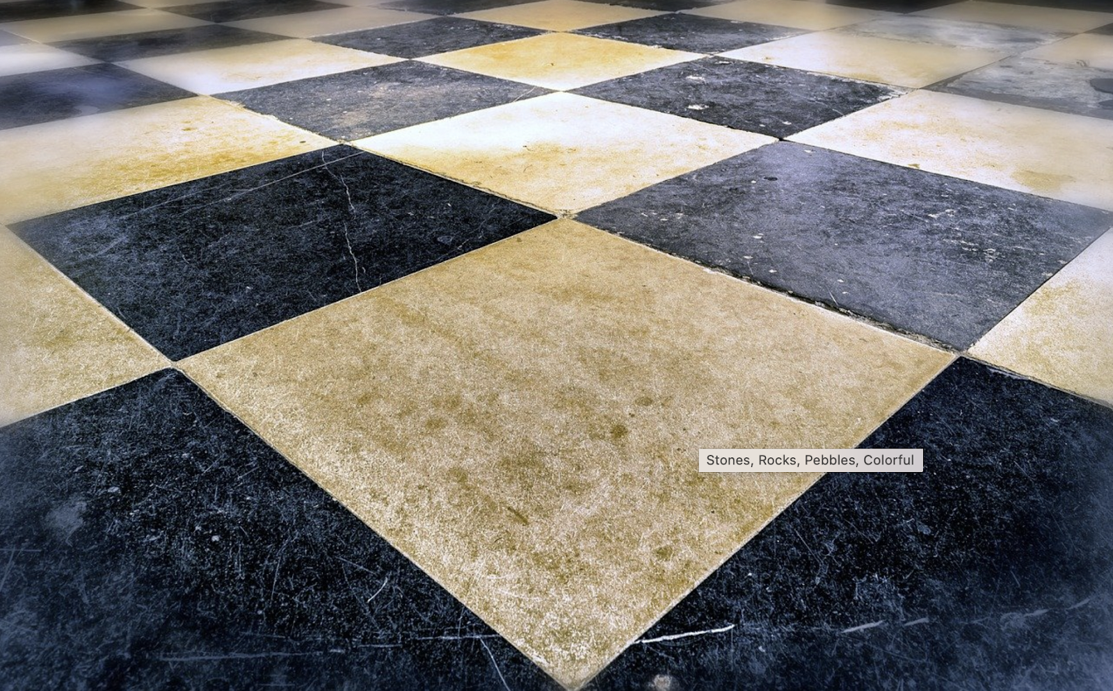 An image of a black and white tile floor. 
