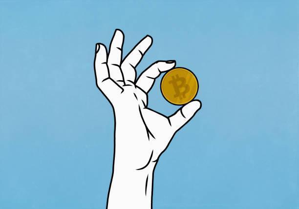 close up hand holding bitcoin on blue background - crypto stock illustrations