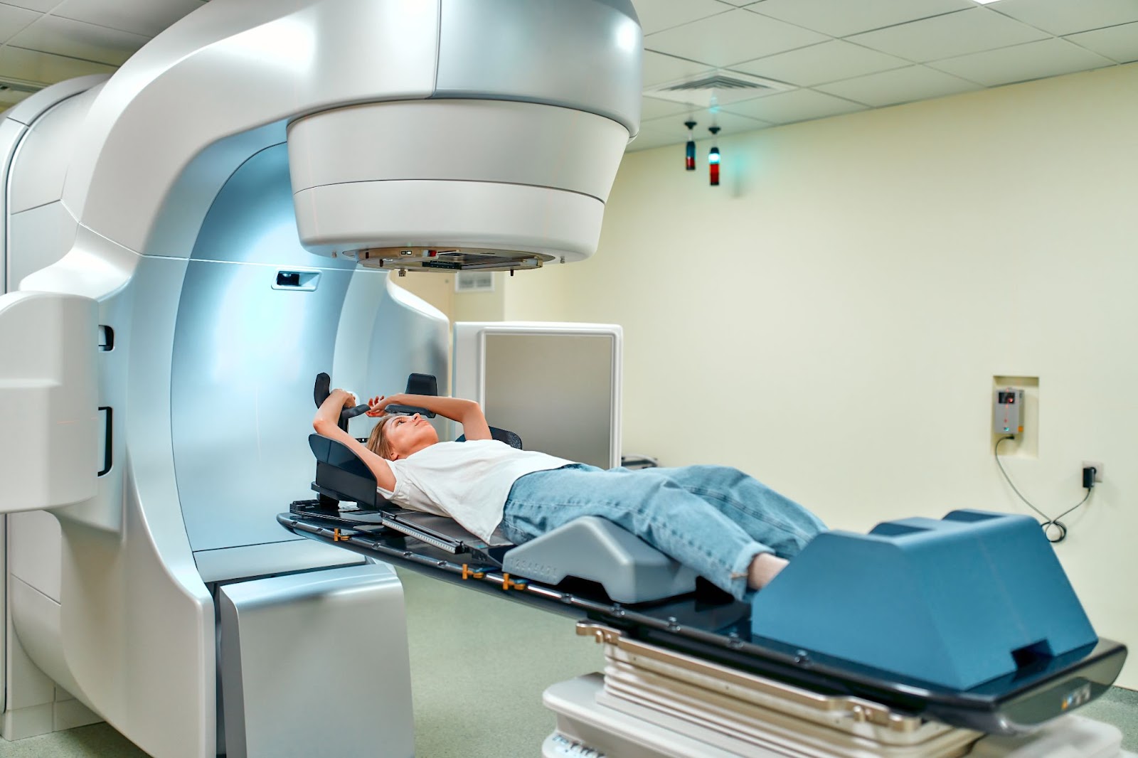 External beam radiation often involves a large machine that delivers radiation to your breast, armpit, and chest. (Adobe Stock)