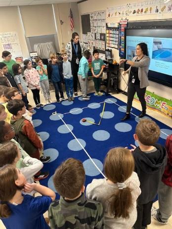 A person standing in front of a group of kids

AI-generated content may be incorrect.