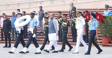 A group of people walking in military uniformsDescription automatically generated