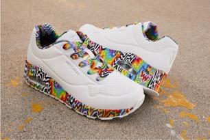 A pair of white shoes with colorful designs

Description automatically generated