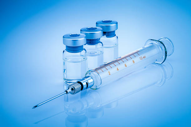 a-glass-syringe-lying-next-to-three-vials-filled-with-clear-liquid-on-a-blue-background-you-burned-out-on-stims-vesilute-is-the-only-thing-thatll-save-your-brain-tony-huge