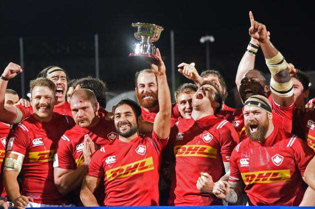 Canadian fans cheering in rugby gear
