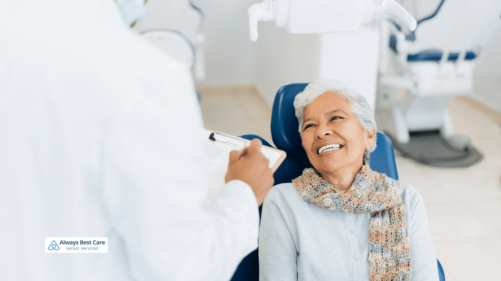 This is an image depicting a senior woman smiling during dental appointment