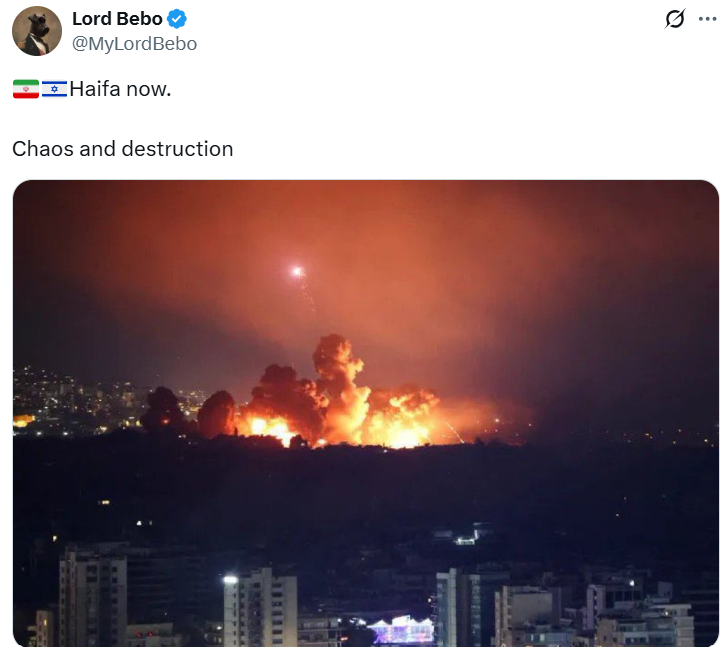 A photo claiming to show flames and smoke rising in Haifa, Israel, following a massive Iranian missile strike that allegedly caused chaos and destruction.