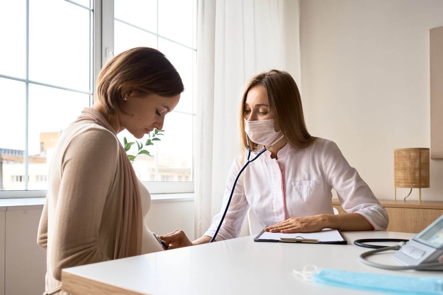 Pregnant woman at a doctors office during an exam