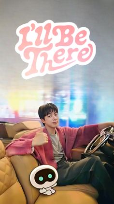 This contain Jin sitting on top of a couch next to a cartoon character his music video  "I'll Be There"
 