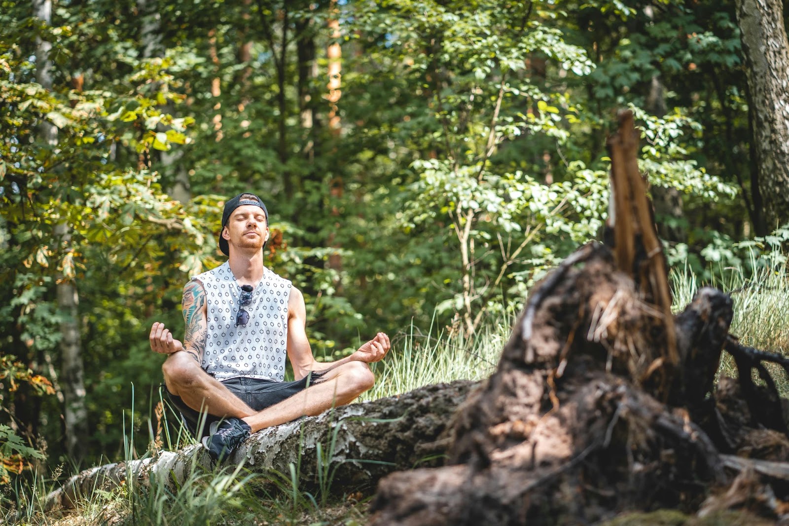 man meditating outdoors