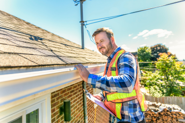 how to winterize your michigan homes exterior roofing inspector checking gutters custom built okemos