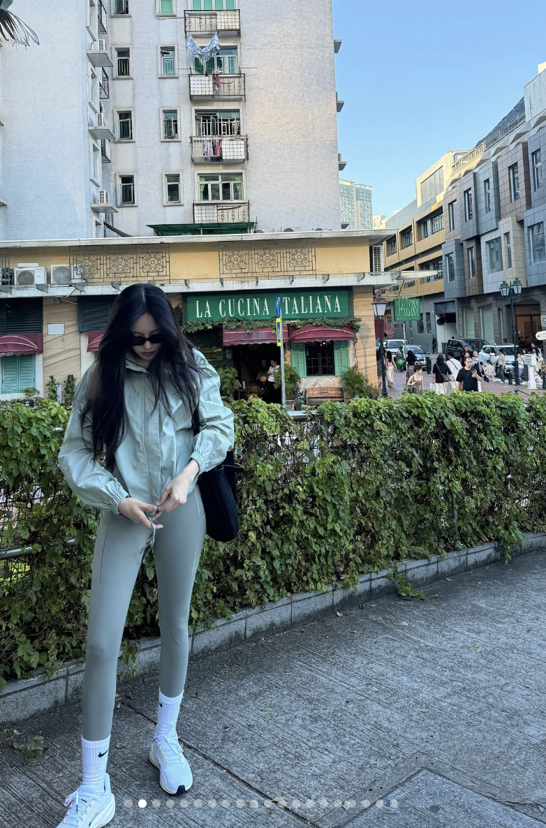 Hyomin's trip to Macao rocking a matching sage green top and leggings set