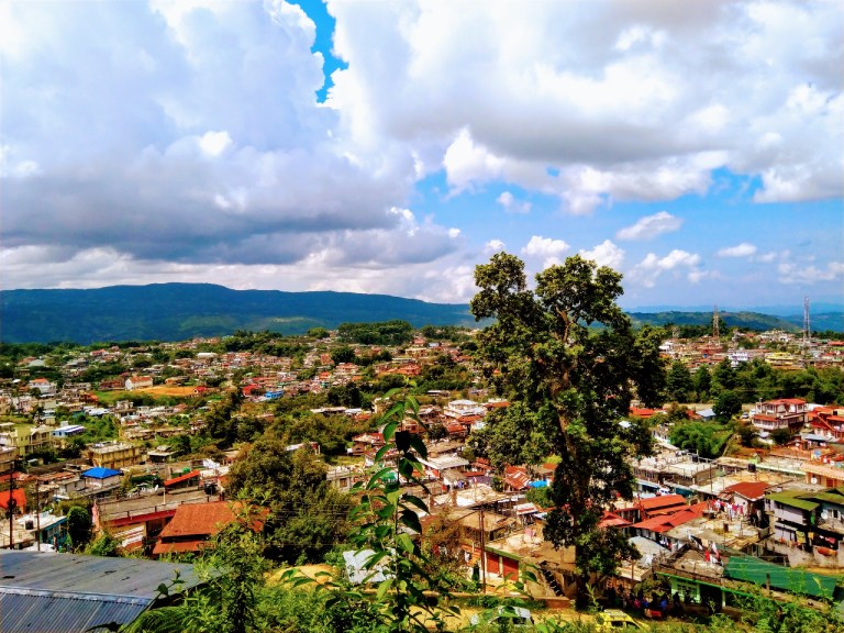Shillong, Meghalaya, with misty hills, beautiful waterfalls, and the charming blend of traditional and modern architecture.