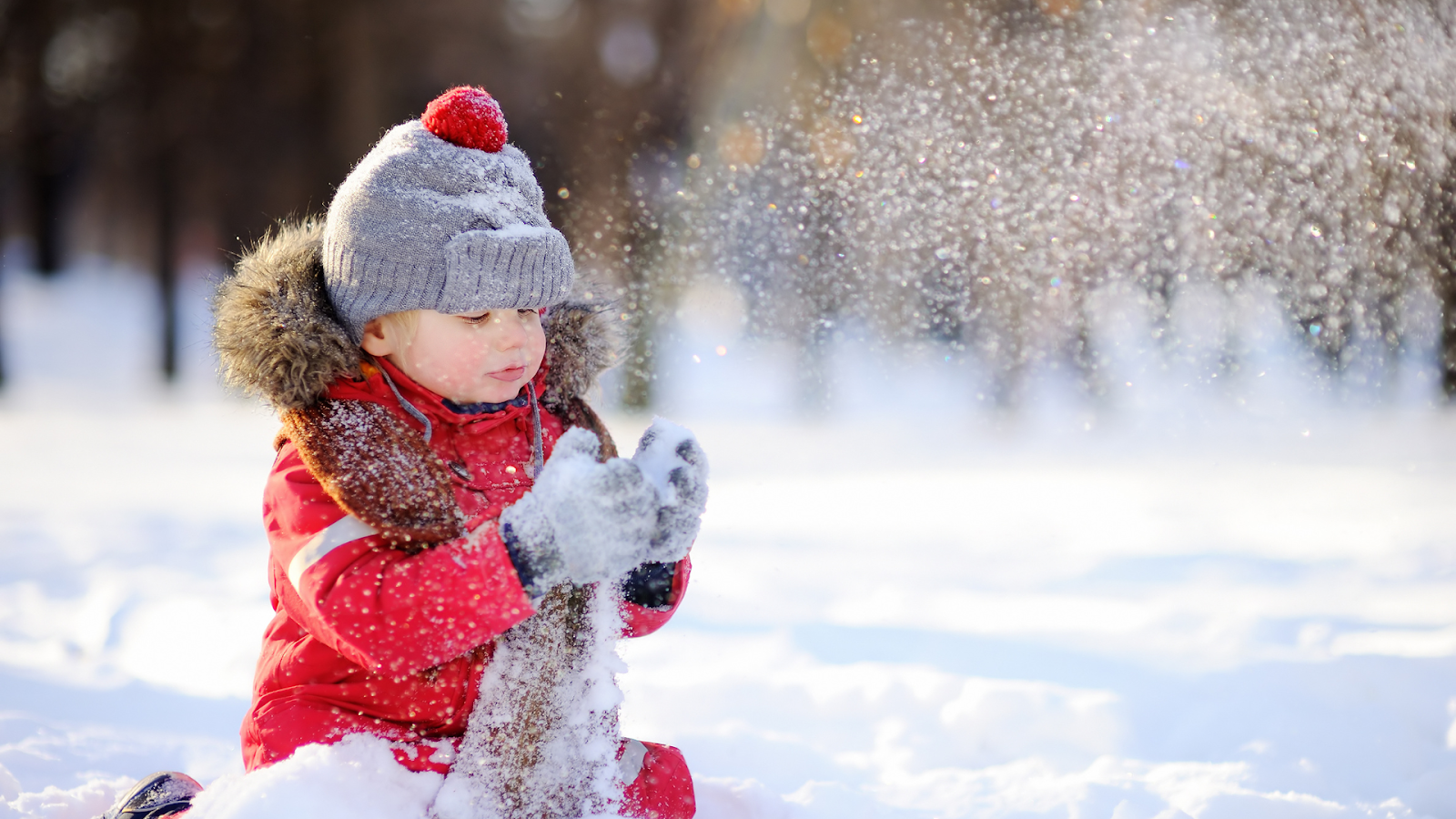 Kid playing in the snow // Healthier Baby Today