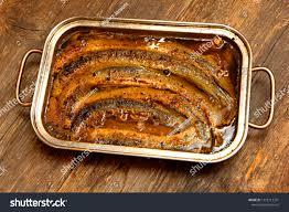 A metal container with food in it

Description automatically generated