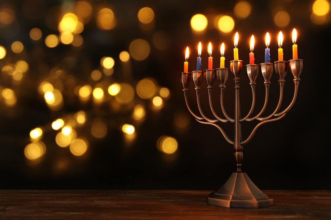 A menorah lights up the night.