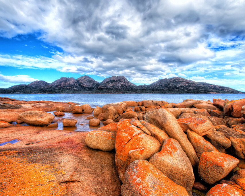 Scenic view of Tasmania with rugged landscapes and vibrant rocks.