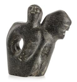 A stone sculpture of two people

Description automatically generated