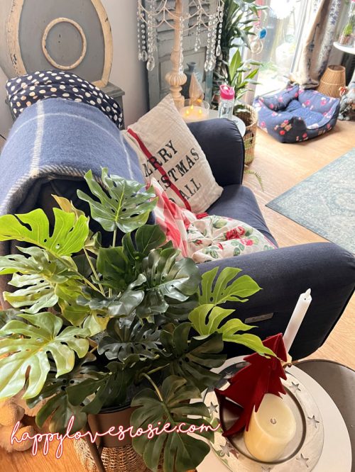 blue armchair with Merry Christmas cushion