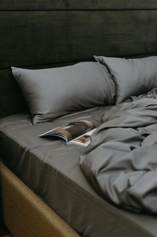 A magazine on a bedDescription automatically generated