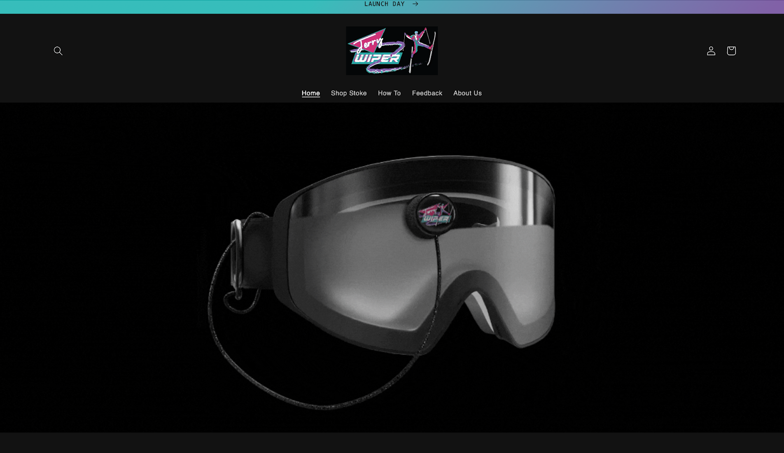 an image of the website for the Jerry Wiper, it shows a black screen with snow goggles showing the Jerry Wiper attached to it